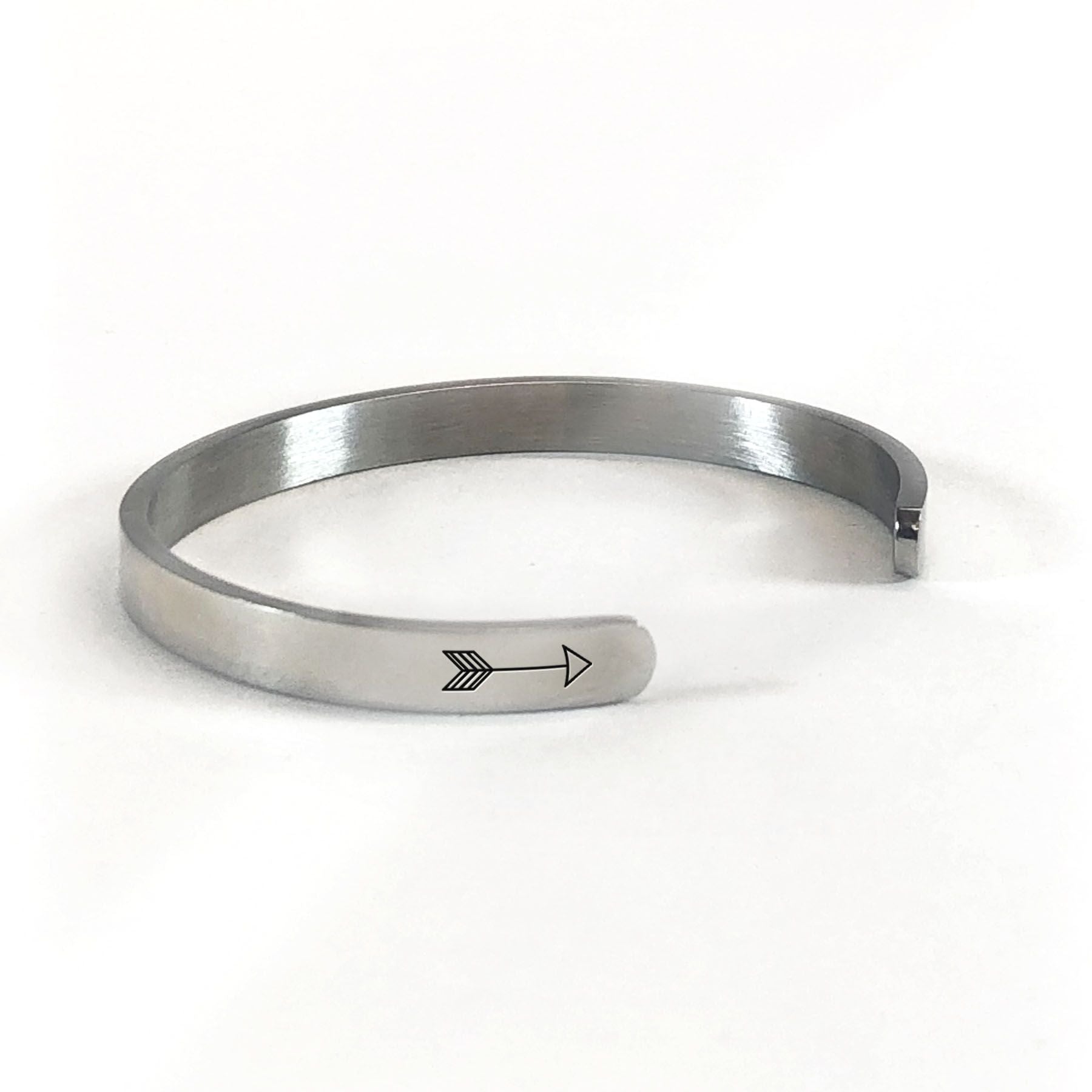 Kind heart, fierce mind, brave spirit bracelet with silver plating rotated to show arrows and cuff opening