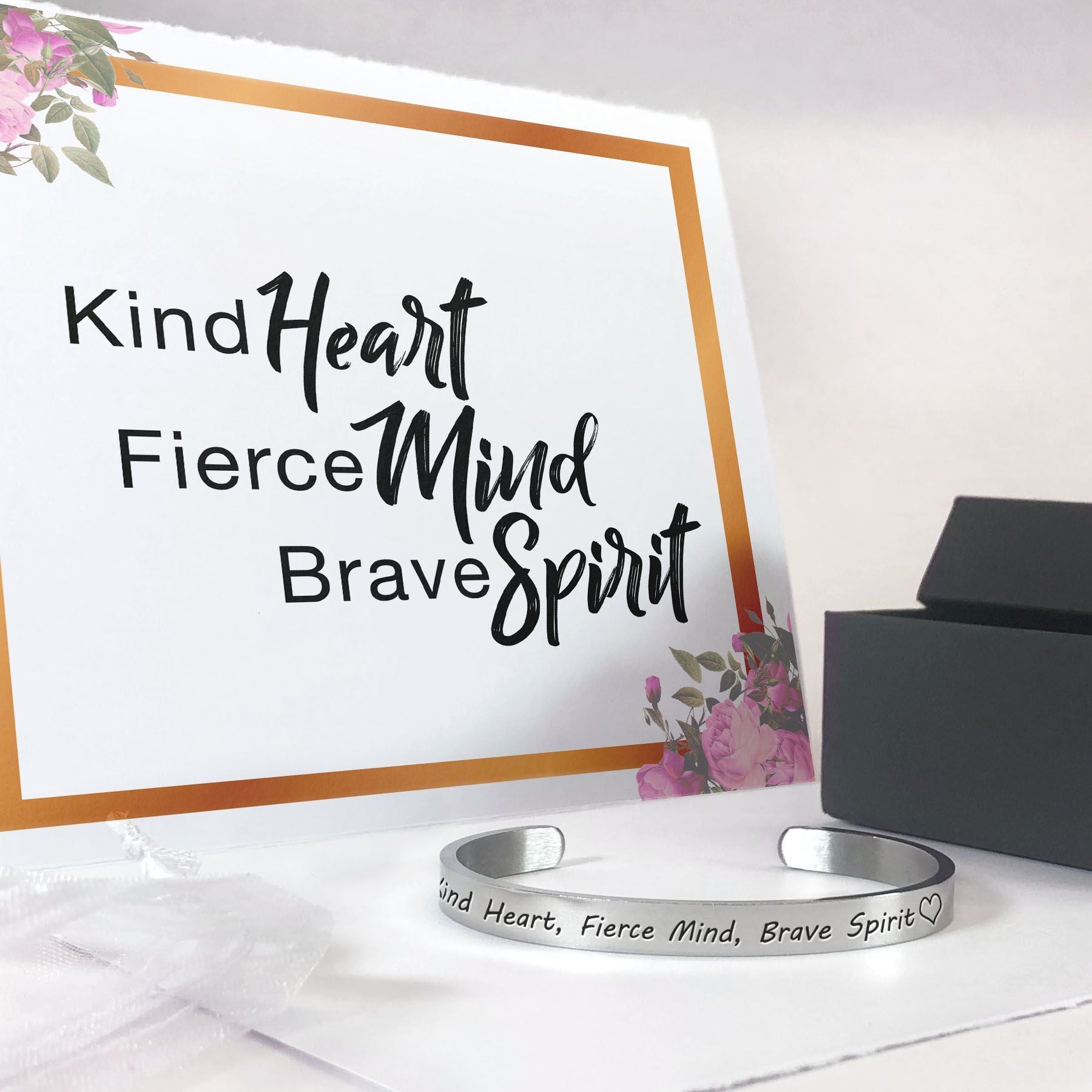 Kind heart, fierce mind, brave spirit bracelet with silver plating in front of a gift box with bag and gift card in the background