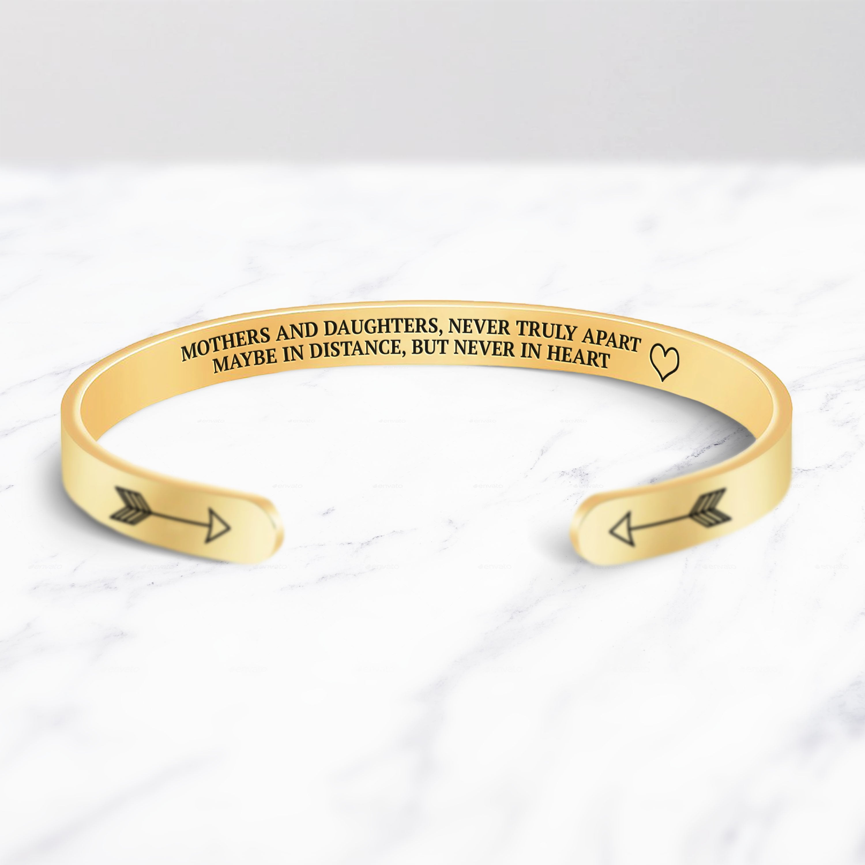 Mothers and Daughters Never Truly Part Cuff Bracelet bracelet with gold plating on a marble background