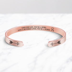 Save a hundred lives, You're a nurse Cuff Bracelet bracelet with rose gold plating on a marble background